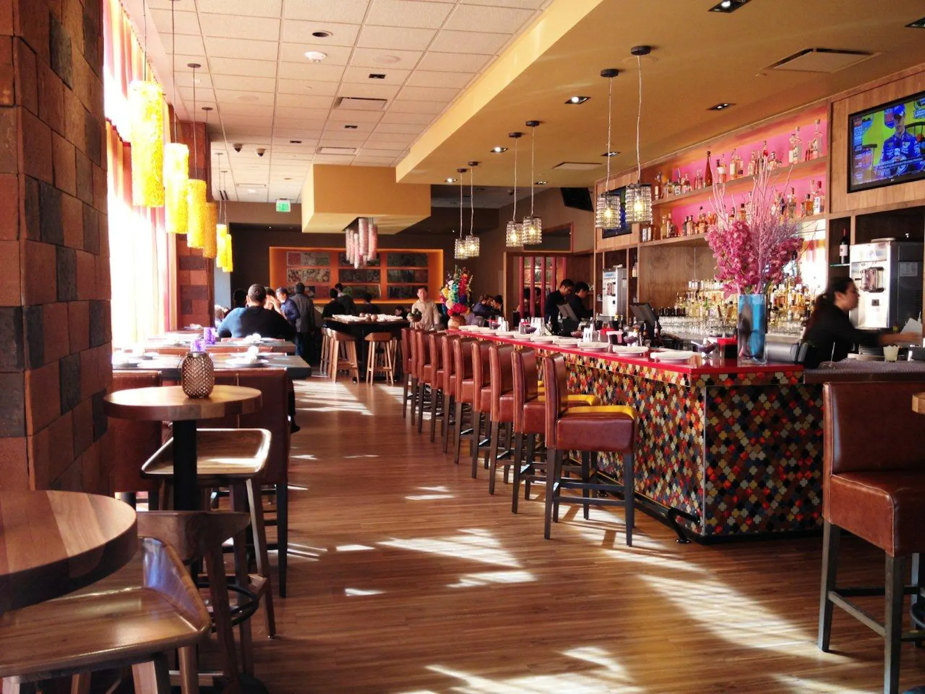 warmly lit bar and dining room